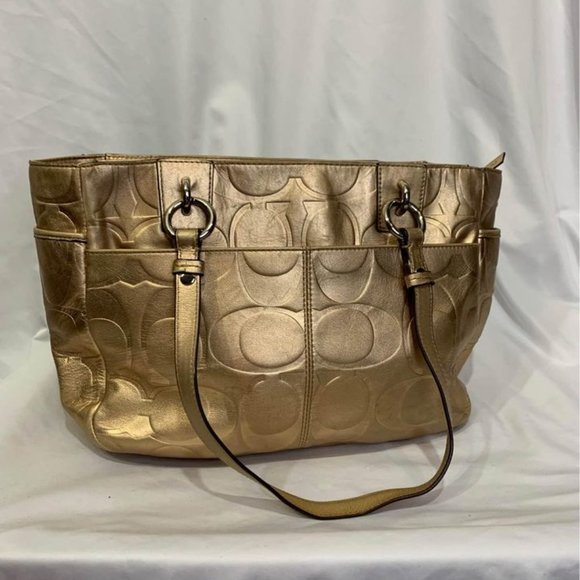 COACH gold handbag. Purple lining. Embedded coach logo. Big outside pock… - Picture 5 of 10